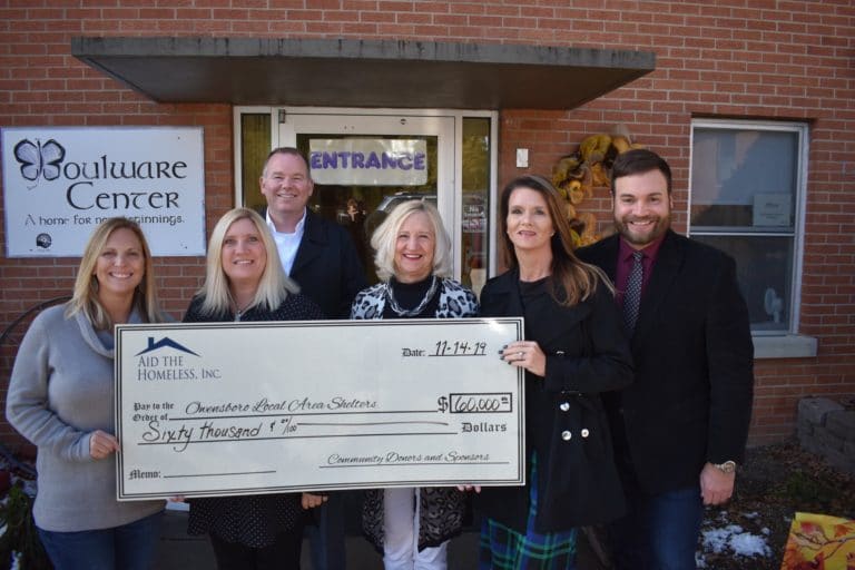 Aid the Homeless presents a check at Boulware Center